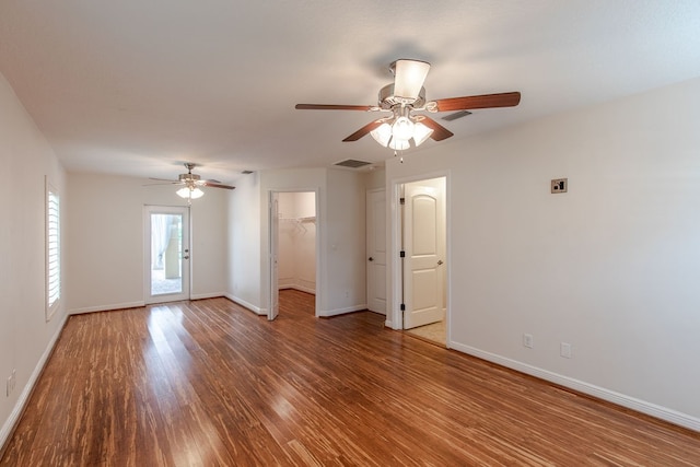 spare room featuring hardwood / wood-style floors and ceiling fan