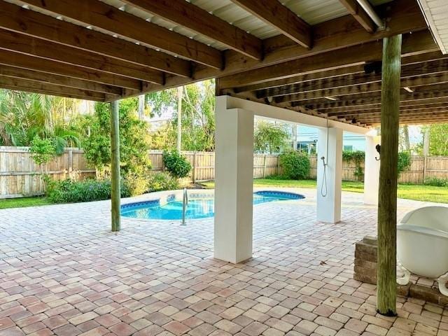 view of swimming pool with a patio