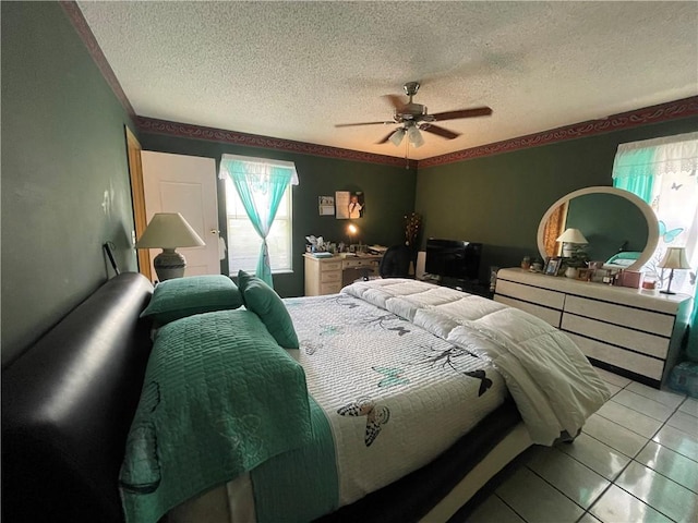 tiled bedroom featuring multiple windows, a textured ceiling, and ceiling fan