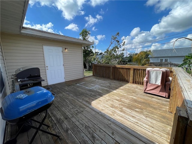 wooden terrace featuring grilling area