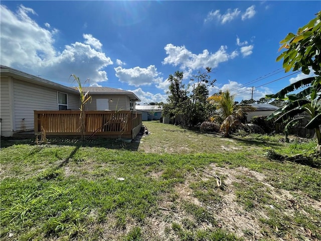 view of yard featuring a wooden deck