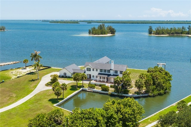 drone / aerial view with a water view