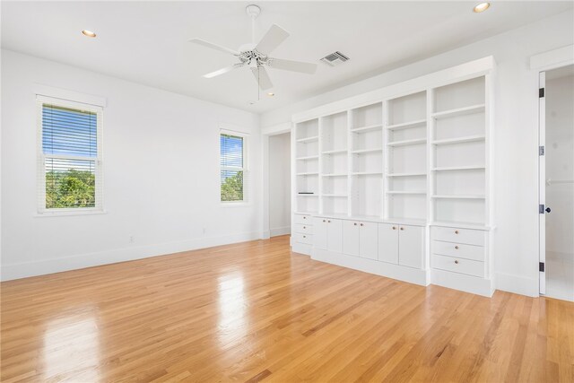 unfurnished bedroom with light hardwood / wood-style floors and ceiling fan