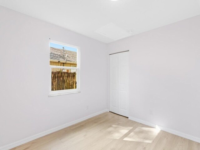 spare room with light wood-type flooring