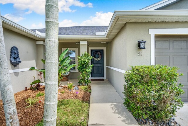 doorway to property featuring a garage