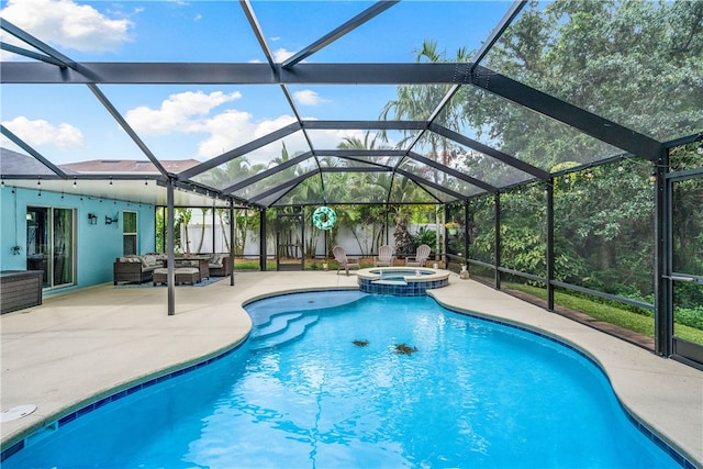 view of swimming pool featuring a lanai, an outdoor living space, a patio, and an in ground hot tub