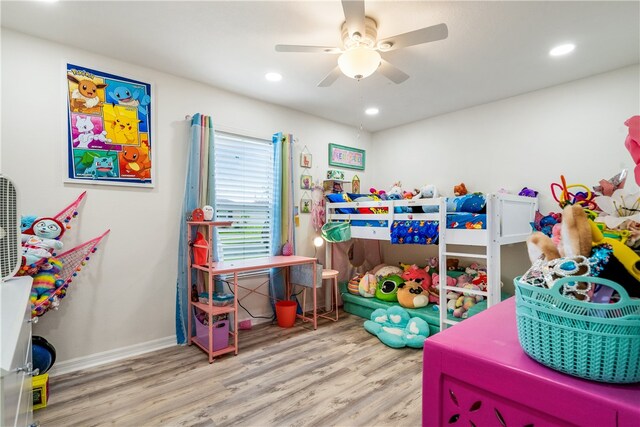 bedroom with wood-type flooring and ceiling fan