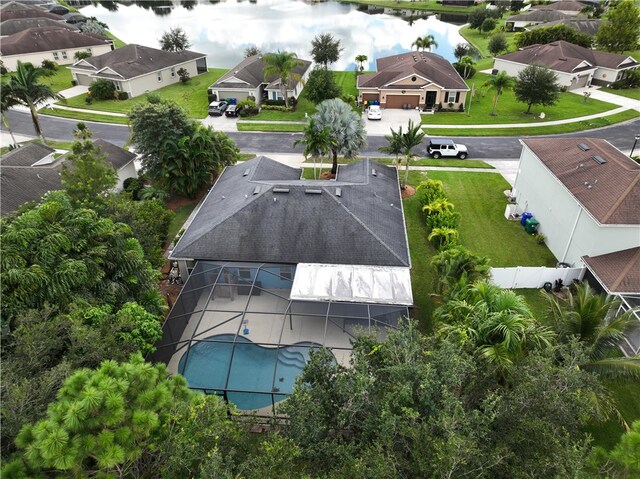 birds eye view of property with a water view