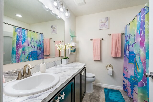 bathroom featuring walk in shower, tile patterned floors, vanity, and toilet