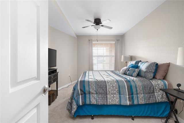 bedroom with light carpet and ceiling fan