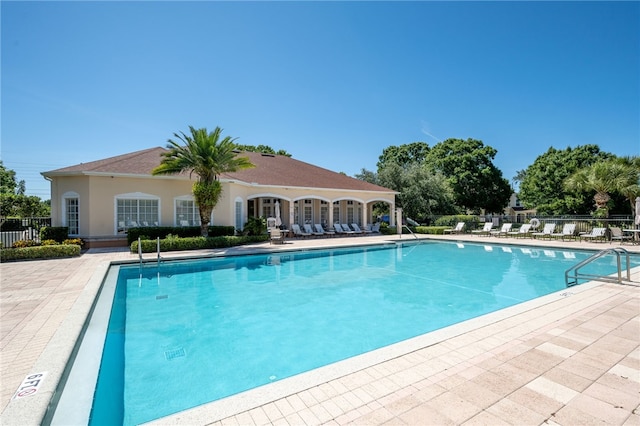 view of swimming pool with a patio area