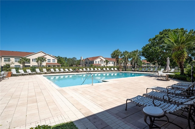 view of swimming pool with a patio area