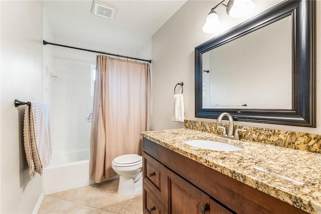 226 21st Ave, Vero Beach, FL 32962 - bathroom with vanity, toilet, shower / tub combo with curtain, and tile patterned floors