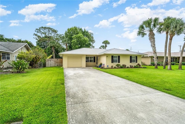 226 21st Ave, Vero Beach, FL 32962 - ranch-style house with a garage, stucco siding, driveway, and metal roof