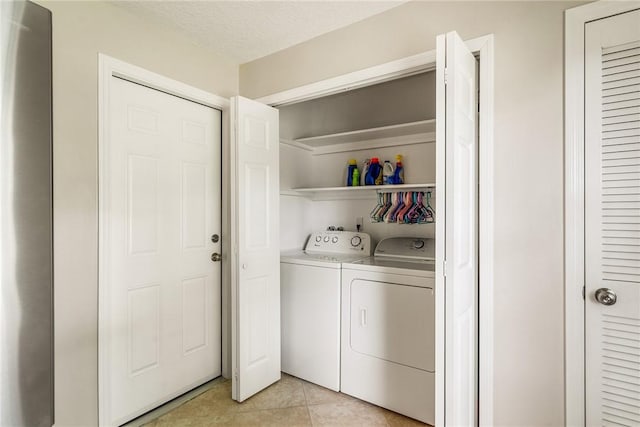 226 21st Ave, Vero Beach, FL 32962 - laundry room with separate washer and dryer and light tile patterned flooring