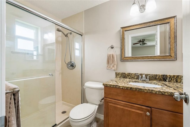 226 21st Ave, Vero Beach, FL 32962 - bathroom featuring a stall shower, toilet, vanity, and baseboards
