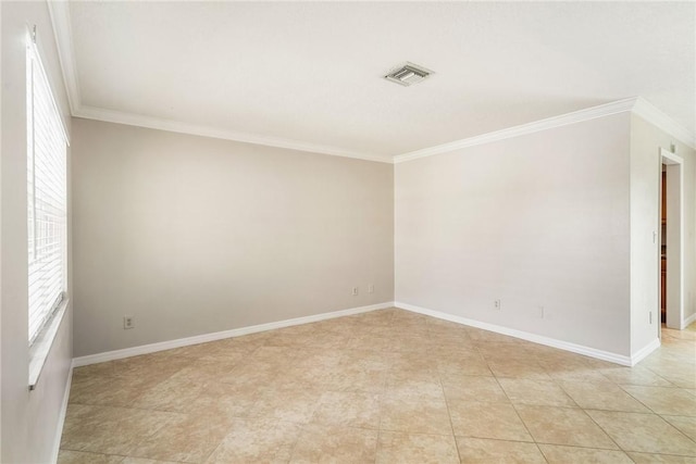 226 21st Ave, Vero Beach, FL 32962 - spare room with healthy amount of natural light, crown molding, baseboards, and light tile patterned floors