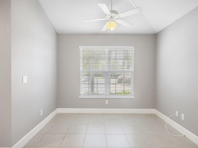 508 Calamondin Way SW, Vero Beach, FL 32968 - unfurnished room featuring light tile patterned floors, baseboards, and a ceiling fan