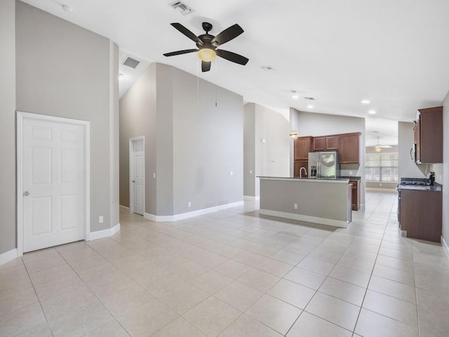 508 Calamondin Way SW, Vero Beach, FL 32968 - unfurnished living room featuring visible vents, baseboards, ceiling fan, and light tile patterned flooring