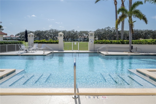 view of swimming pool featuring a patio