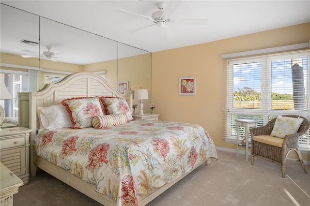 bedroom featuring ceiling fan and light colored carpet