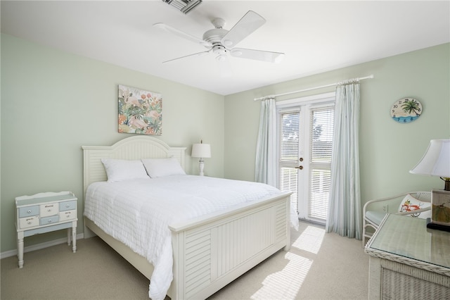 bedroom with ceiling fan and light carpet