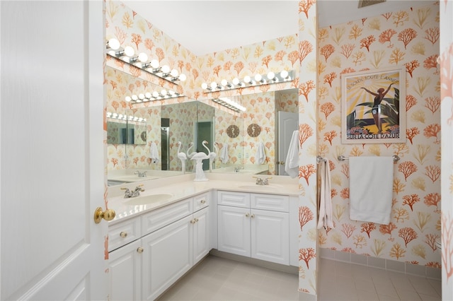 bathroom featuring tile patterned flooring and vanity