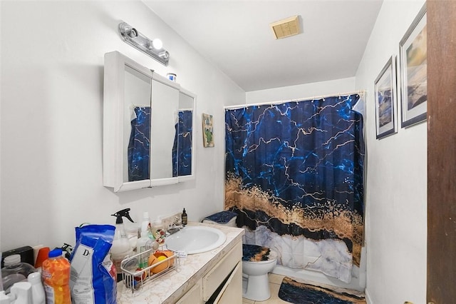 bathroom featuring tile patterned flooring, vanity, a shower with curtain, and toilet