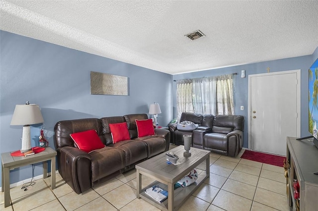 tiled living room with a textured ceiling