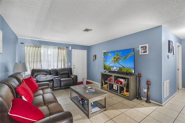 tiled living room with a textured ceiling