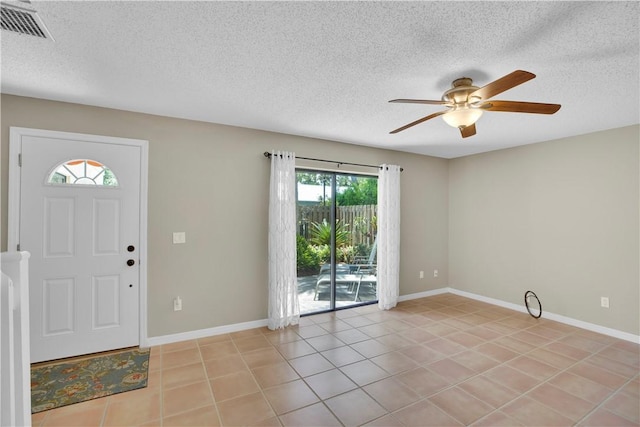 1011 Royal Palm Blvd Unit B3, Vero Beach, FL 32960 - entryway with a ceiling fan, a textured ceiling, and light tile patterned floors