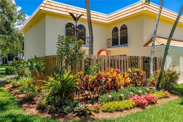 1011 Royal Palm Blvd Unit B3, Vero Beach, FL 32960 - view of side of home featuring a tiled roof and stucco siding