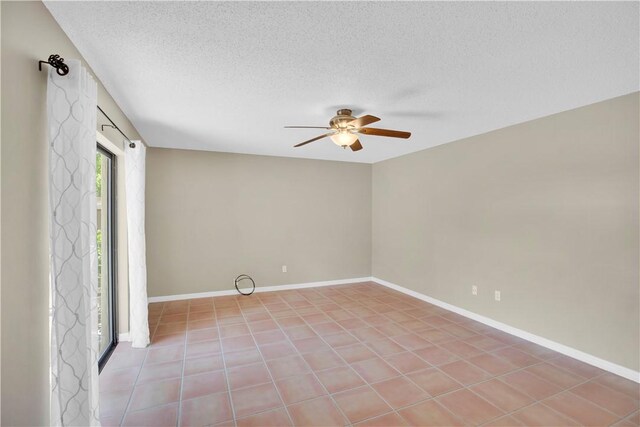 1011 Royal Palm Blvd Unit B3, Vero Beach, FL 32960 - empty room featuring a ceiling fan, a textured ceiling, and light tile patterned floors