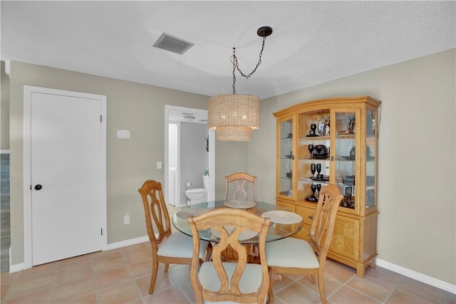 1011 Royal Palm Blvd Unit B3, Vero Beach, FL 32960 - dining space featuring light tile patterned floors and a chandelier