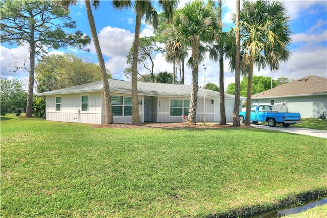 ranch-style house with a front lawn