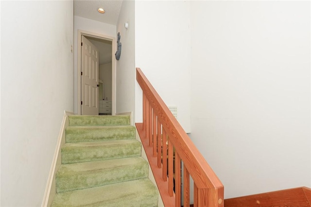 stairway with carpet floors, baseboards, and recessed lighting