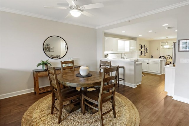 940 Turtle Cove Ln Unit 207, Vero Beach, FL 32963 - dining room with dark wood-style flooring, ornamental molding, ceiling fan, and recessed lighting