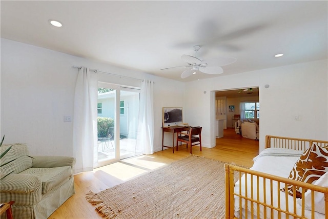 sitting room featuring ceiling fan and light hardwood / wood-style floors