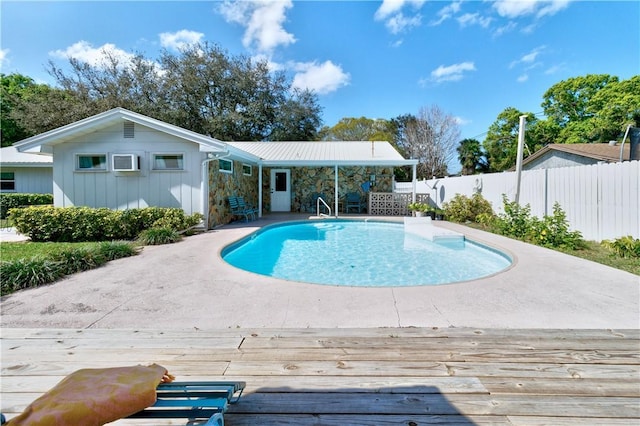 view of swimming pool featuring a wooden deck