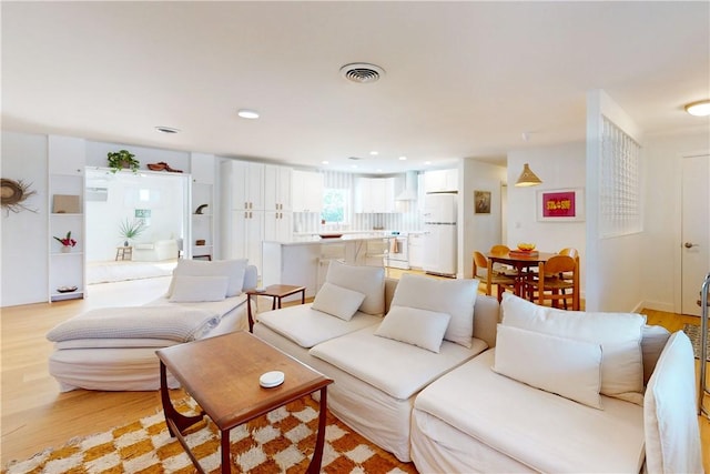 living room with light hardwood / wood-style floors