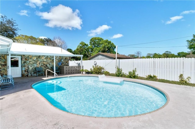 view of pool featuring a patio