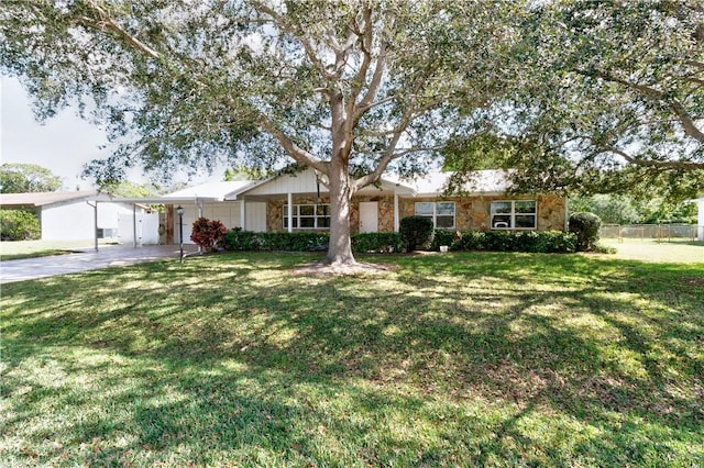 ranch-style house with a front lawn