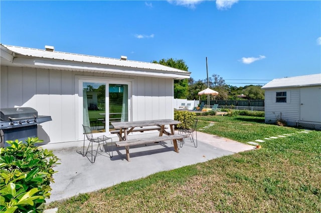 exterior space with a shed and a grill