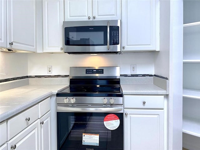 kitchen with white cabinets and stainless steel appliances