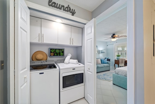 laundry room featuring cabinets, ceiling fan, and washer and dryer