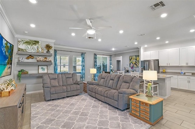 living room with a ceiling fan, visible vents, crown molding, and recessed lighting