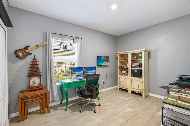 office area featuring baseboards