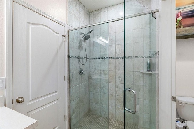 full bath with a shower stall and toilet