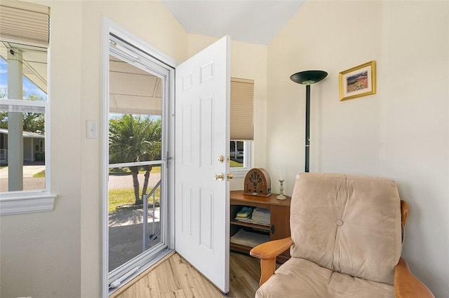 doorway to outside with light wood-style floors