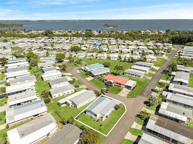 bird's eye view with a water view and a residential view